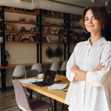 young-attractive-woman-white-shirt-dreamily-looking-camera-with-desk-background-modern-office (2)